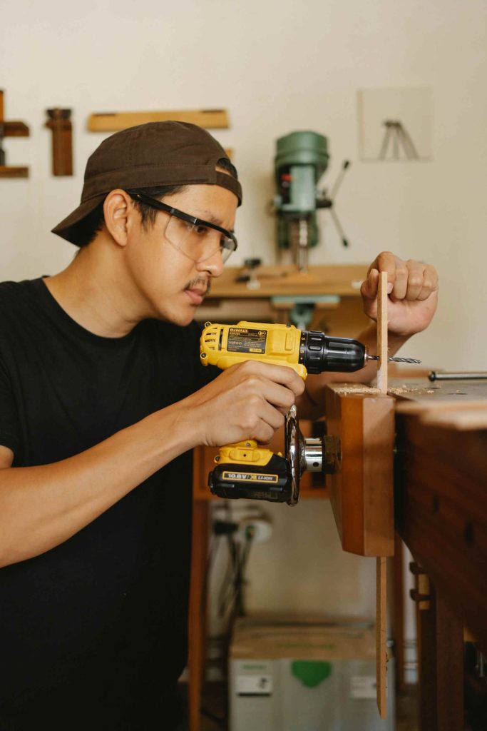man using drill machine